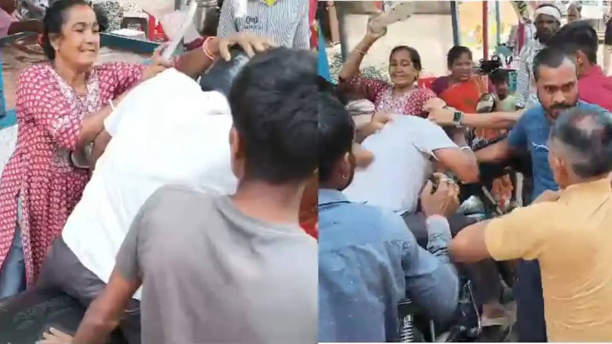लोन के नाम पर ठगी के आरोपी को महिला ने सरेआम सड़क पर पीटा, द लोन के नाम पर ठगी के आरोपी को महिला ने सरेआम सड़क पर पीटा, द