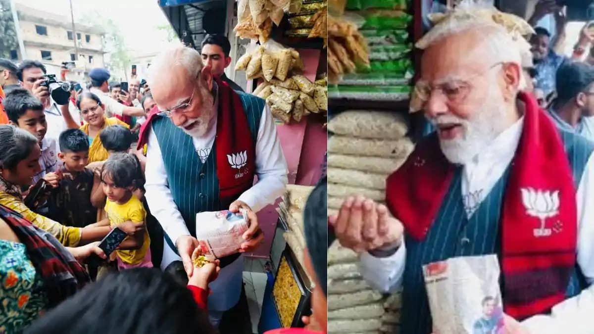 पीएम मोदी के झालमुड़ी खाने पर सियासत, टीएमसी ने लगाया यह आरो पीएम मोदी के झालमुड़ी खाने पर सियासत, टीएमसी ने लगाया यह आरो